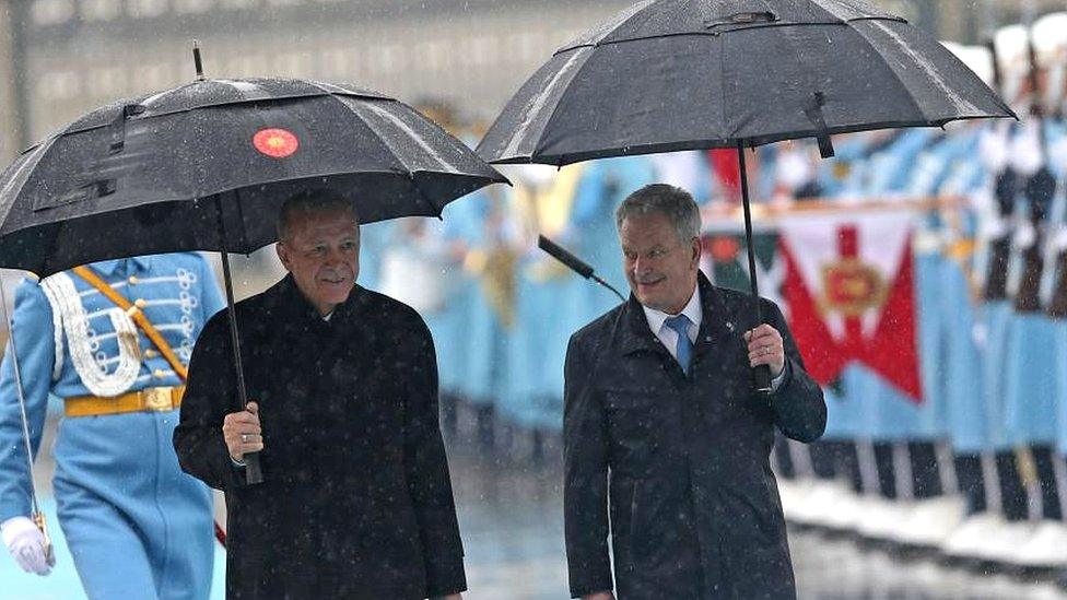 Finland's President Sauli Niinisto (R) and Turkish President Recep Tayyip Erdogan review a honor guard during a welcoming ceremony at the presidential palace in Ankara, Turkey, 17 March 2023