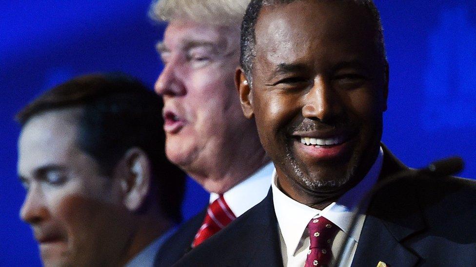 Ben Carson smiles during the Republican debate in Colorado.