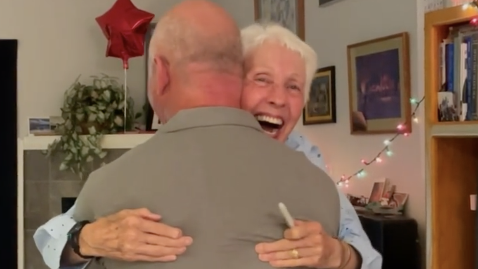 Wally Funk embracing Jeff Bezos after he asked her to fly to space with him