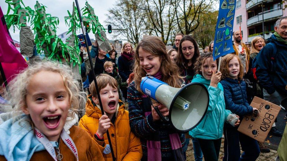 A little boy seen shouting slogans during the demonstration. The march is organized by the Dutch Climate Crisis Coalition, which is collaboration between eleven different organizations and groups.