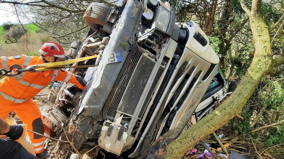 Fire crews working on an overturned lorry