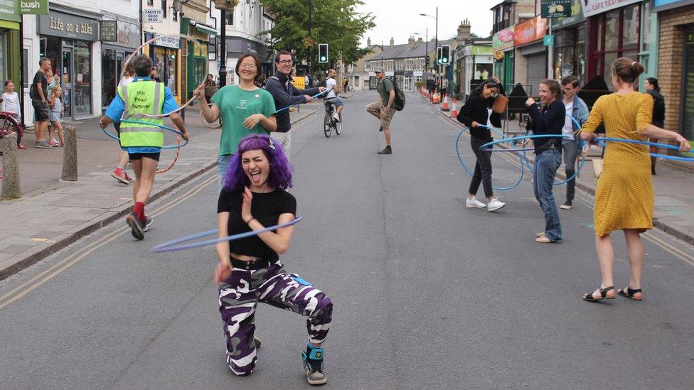 Hula hoopers on Mill Road, Cambridge