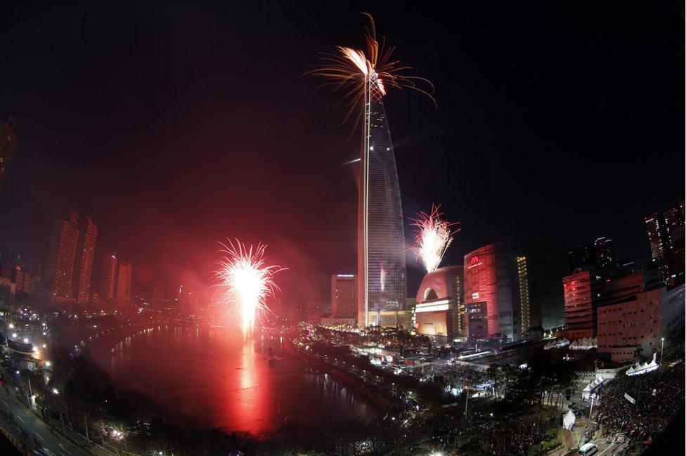 Fireworks explode over the world's fifth 123-storey Lotte World Tower during New Year celebrations in Seoul, South Korea, 01 January 2018