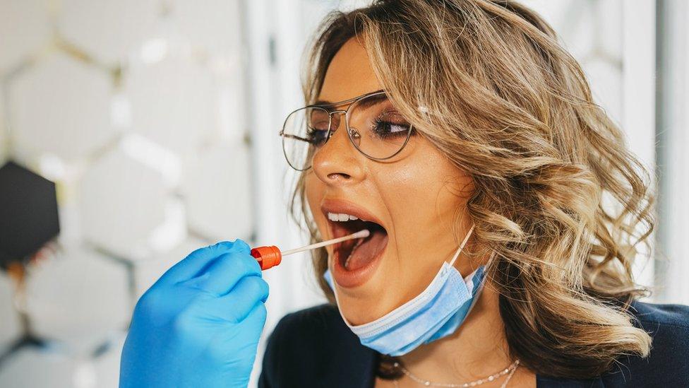 Woman being swab-tested