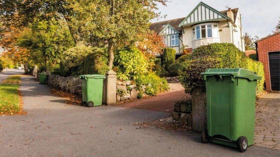 Green bins outside homes in Sheffield