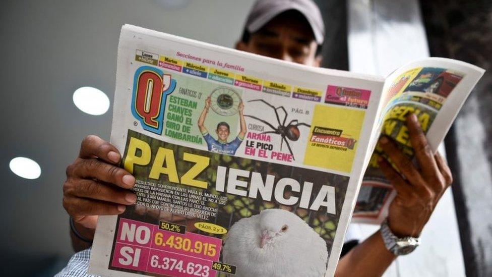 A man reads a newspaper announcing the results of the referendum that surprisingly said "No" to the peace agreement between the Colombian government and the FARC guerrillas in Cali, Colombia, on October 3, 2016.