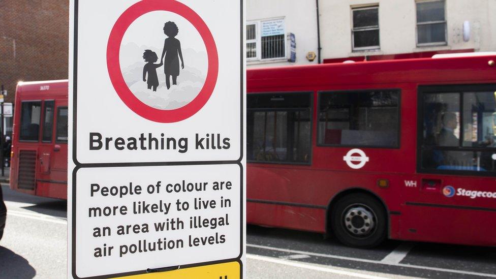 Signs warn that people of colour are more likely to live in areas with high levels of pollution