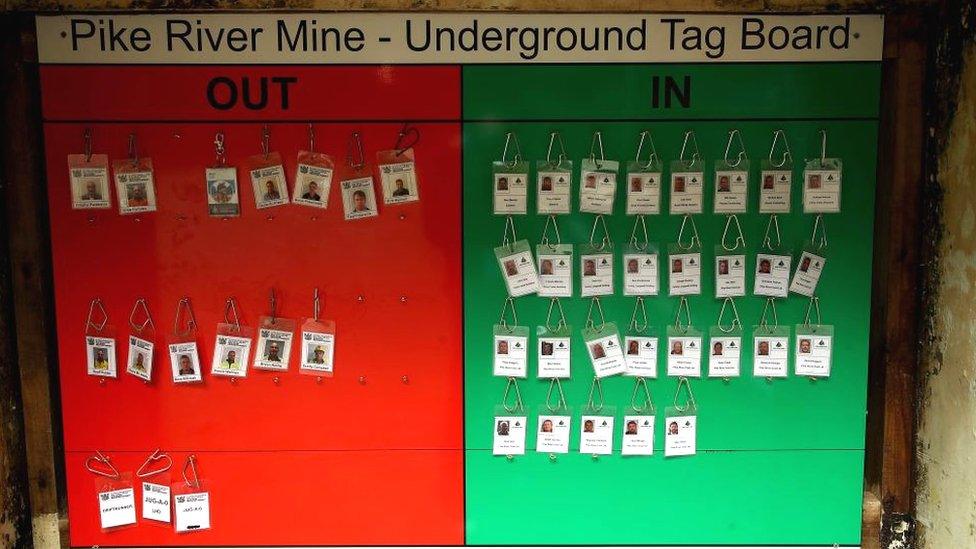 A board with the tags of the 29 missing miners