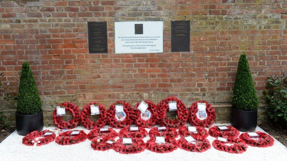 The memorial with wreaths laid