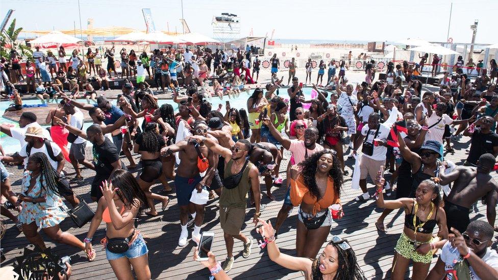 People dancing at afronation festival