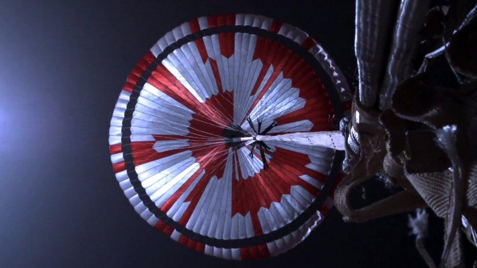 A handout photo made available by NASA shows the parachute of the descent stage during NASA's Perseverance Rover's descent to Mars