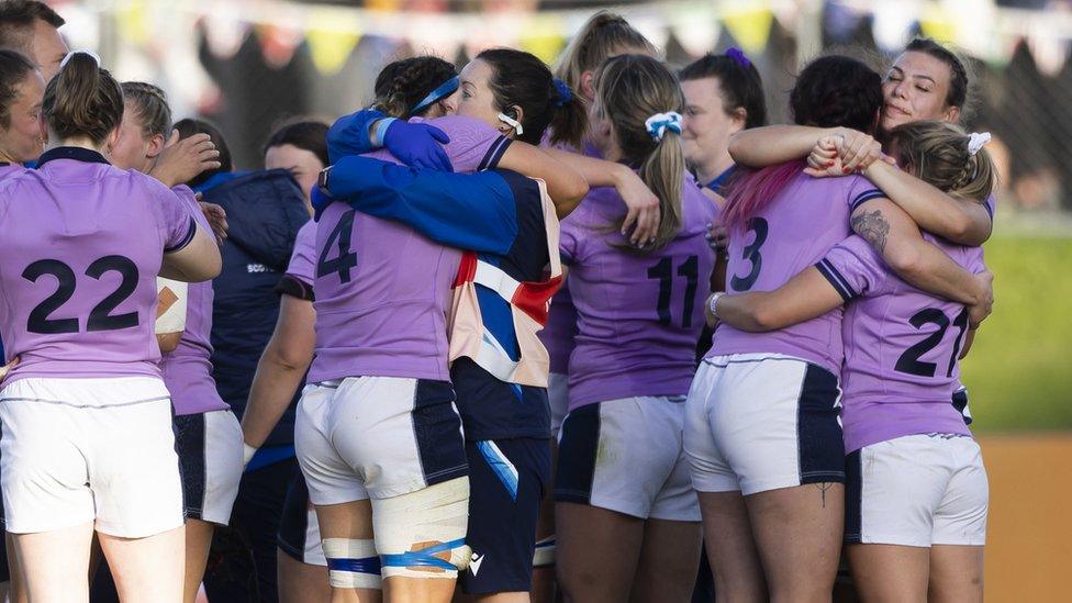 Scotland team hugging after defeat