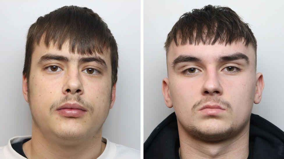 Police custody images of Keiton Underwood and Ace Hill. They are both looking straight at the camera. Underwood has short dark hair and a thin moustache, and he is wearing a white jumper. Hill has short dark hair and a goatee beard. He is wearing a black top.