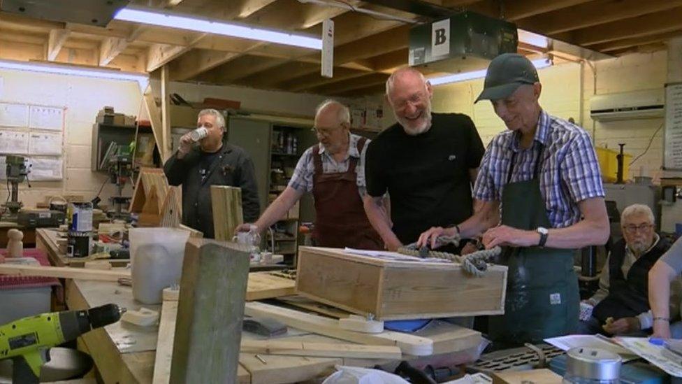 Members working on wooden projects