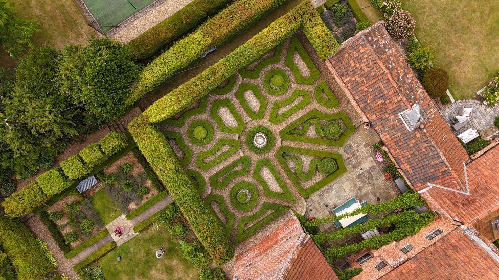 Patterns created by hedges grown in a garden at a home in Norfolk.