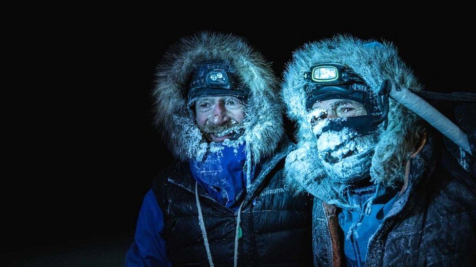 Picture handed out by the Mike Horn Sarl shows Borge Ousland (L) of Norway and South African-born Swiss Mike Horn on 8 December 2019 after arriving at the Lance icebreaker boat in Norwegian waters of the Arctic Ocean