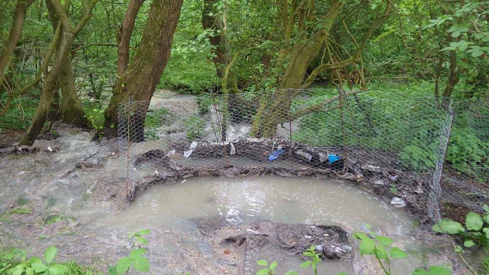 Sewage discharging from a manhole cover