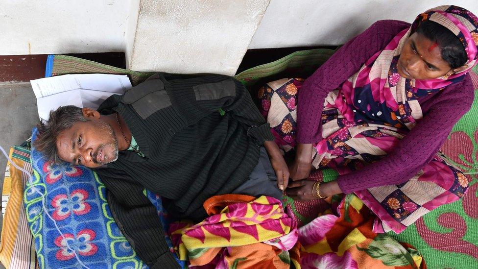 An Indian patient who drank toxic bootleg liquor is treated