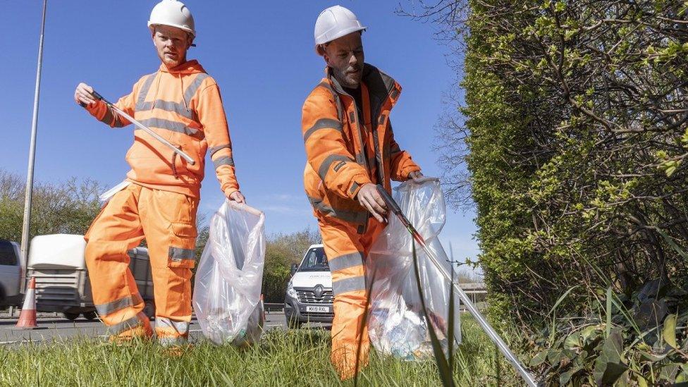 Workers removing litter