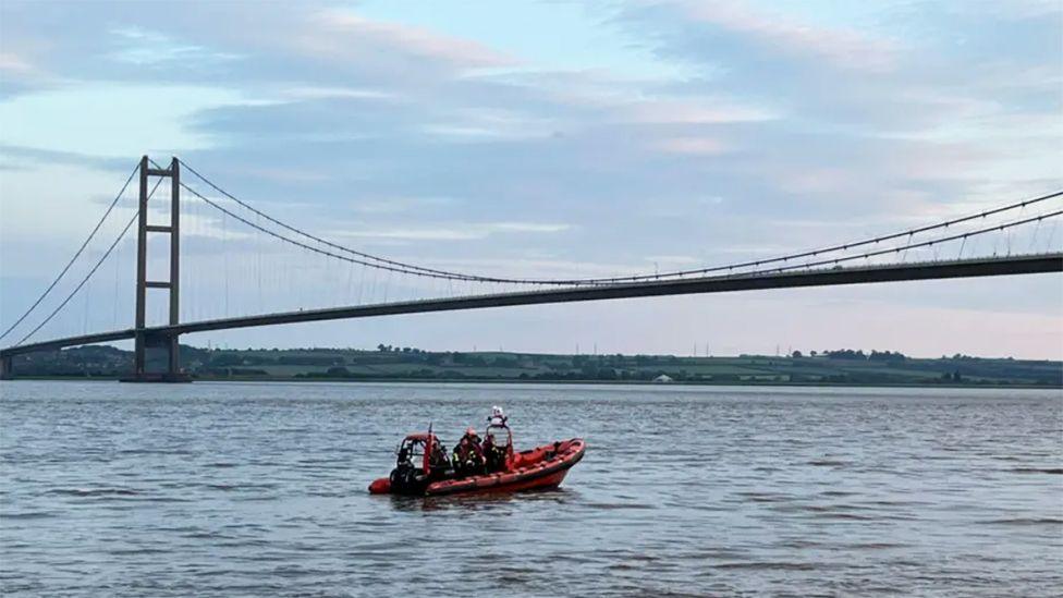 The orange Humber Rescue rib underneath the Humber Bridge