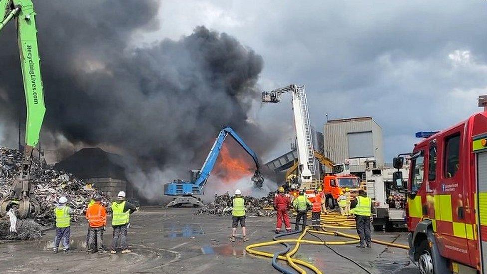 Fire at the site with firefighters around the scene