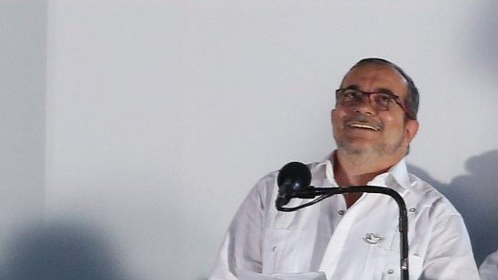 The top commander of the Revolutionary Armed Forces of Colombia, FARC, Rodrigo Londono, known by the alias Timochenko reacts after a group of Colombian Air Force fighter jets fly over the peace signing ceremony in Cartagena, Colombia, Monday, Sept. 26, 2016