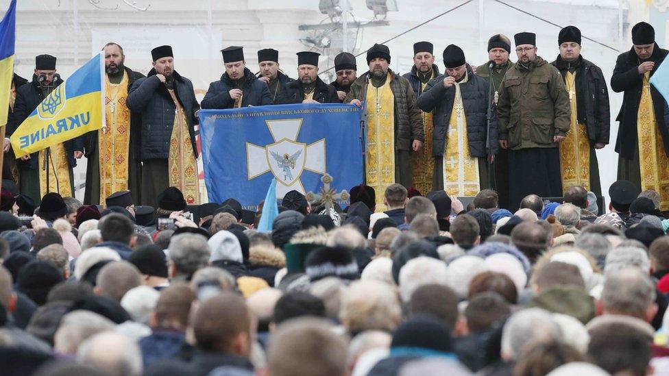 Ukrainians gather outside Saint Sophia's Cathedral in Kiev