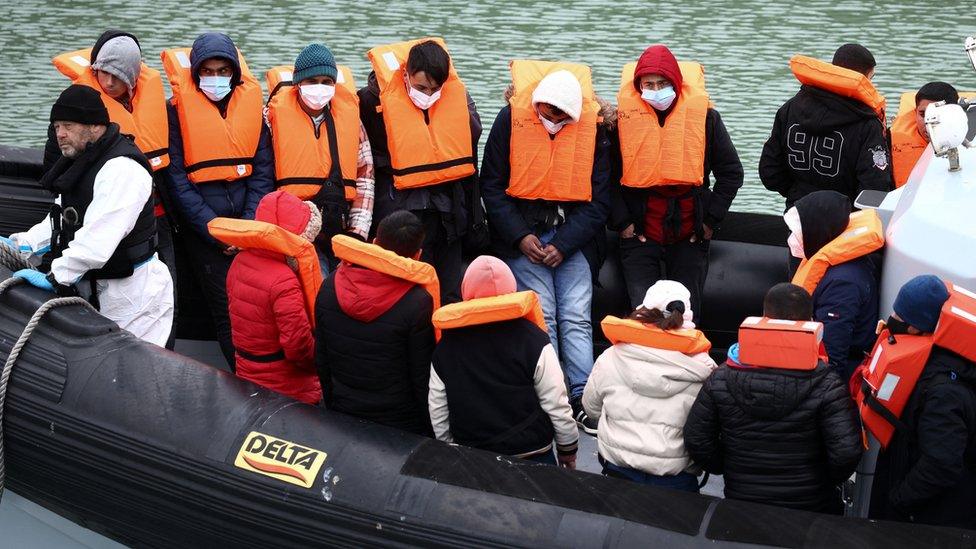 A group of people thought to be migrants crossing the Channel are brought into Dover by Border Force