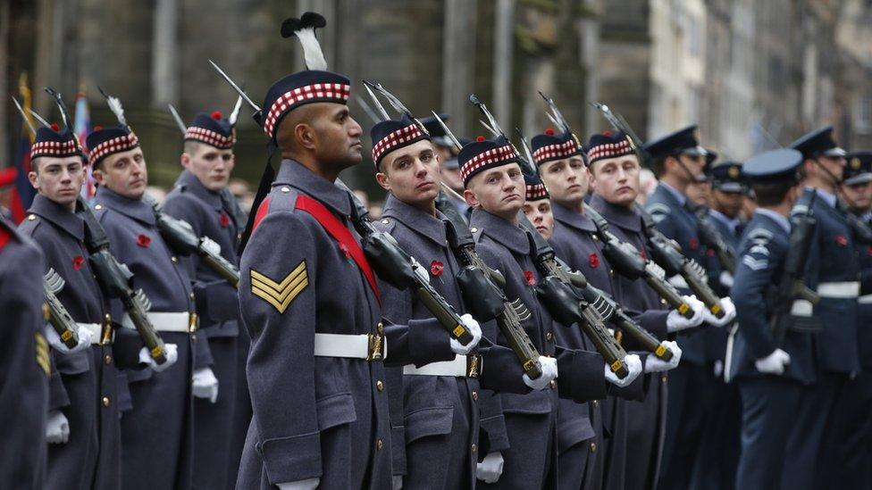 Soldiers line up outside cathedral