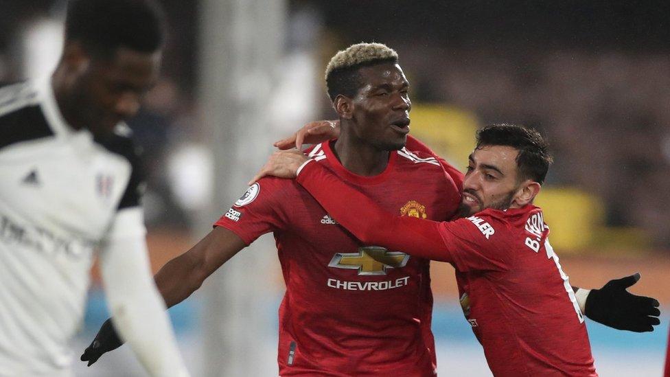 Paul Pogba (centre) celebrates his goal at Fulham