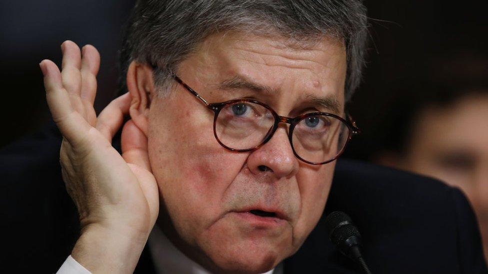 Mr Barr gestures to his ear after he was unable to hear a senator's question