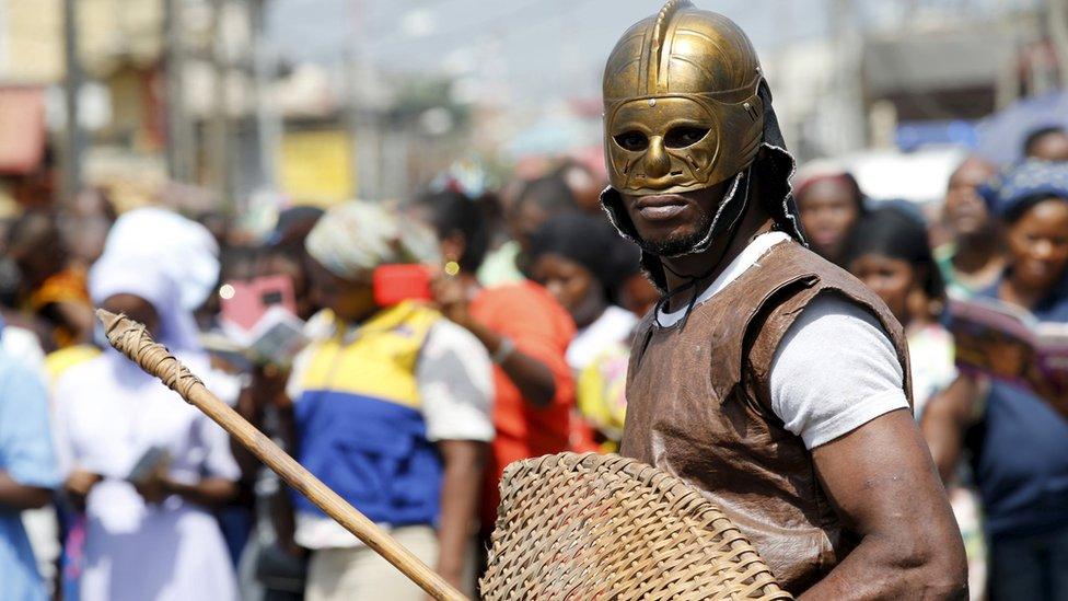 A man dressed up as a soldier takes part in a re-enactment of the crucifixion of Jesus Christ on Good Friday in Lagos, Nigeria 25 March 2016