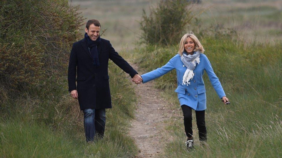 Mr Macron (L) and his wife Brigitte Trogneux