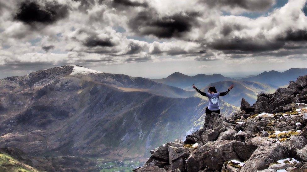 The summit of Elidir Fawr in Snowdonia, looking towards Snowdon.