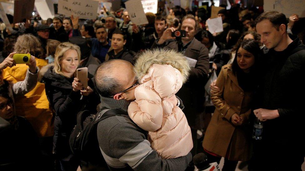 The Bay family is reunited after Hamed Bay was separated from other passengers and questioned as a result of U.S. Donald Trump"s executive order travel ban at Logan Airport in Boston