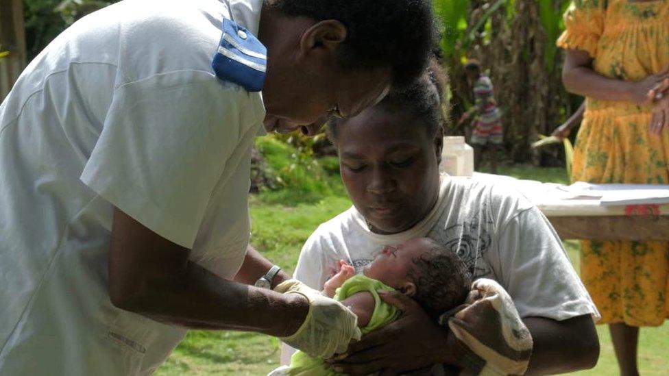 Baby boy getting vaccinated