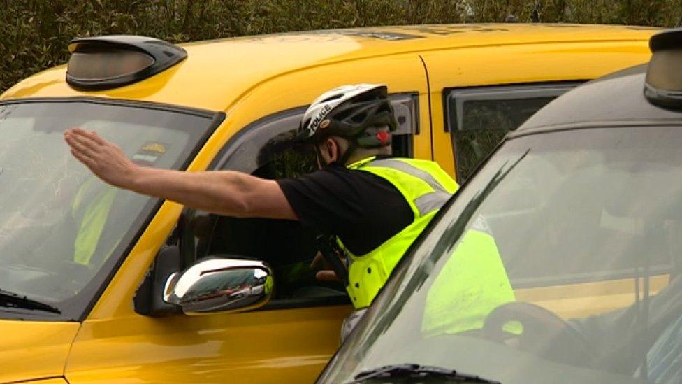 Police with a taxi driver