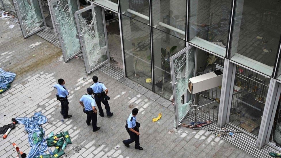 Police stand outside the Legislative Council building in Hong Kong