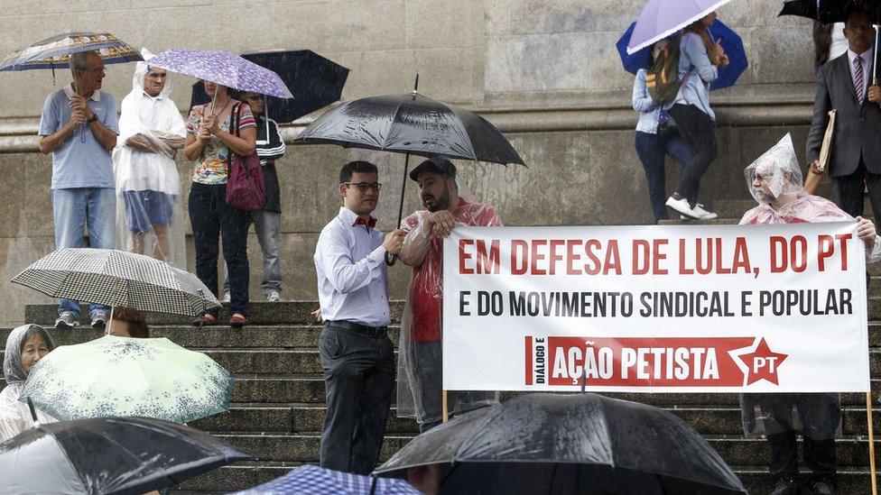 Unionists and members of the Workers Party (PT) demonstrate in support of Brazilian former president Luiz Inacio Lula da Silva in front of The Sao Paulo Cathedral in Sao Paulo, Brazil, on March 11, 2016.