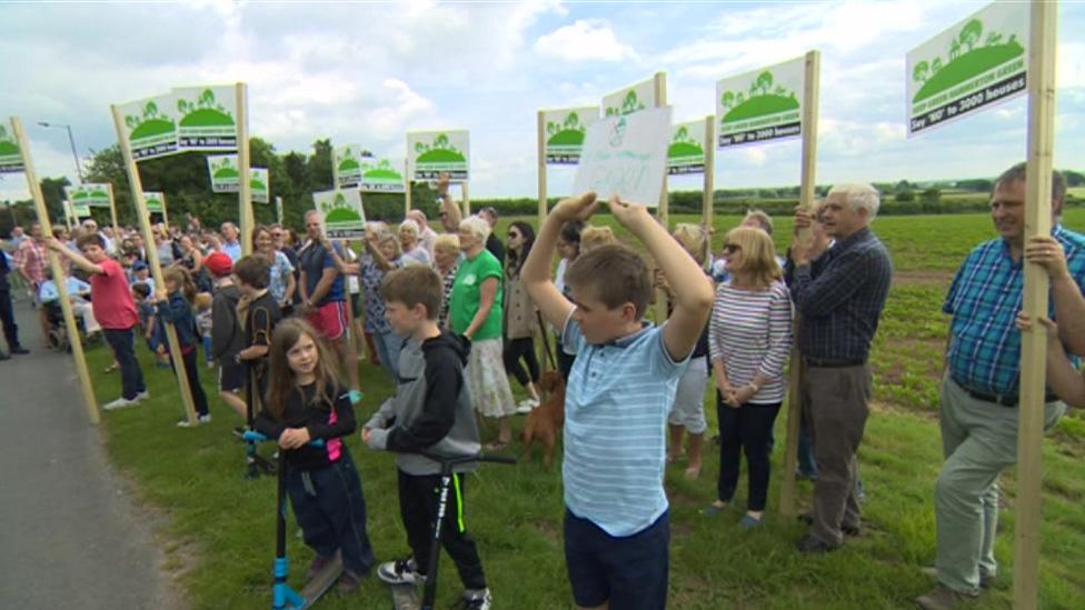 Protesters at village