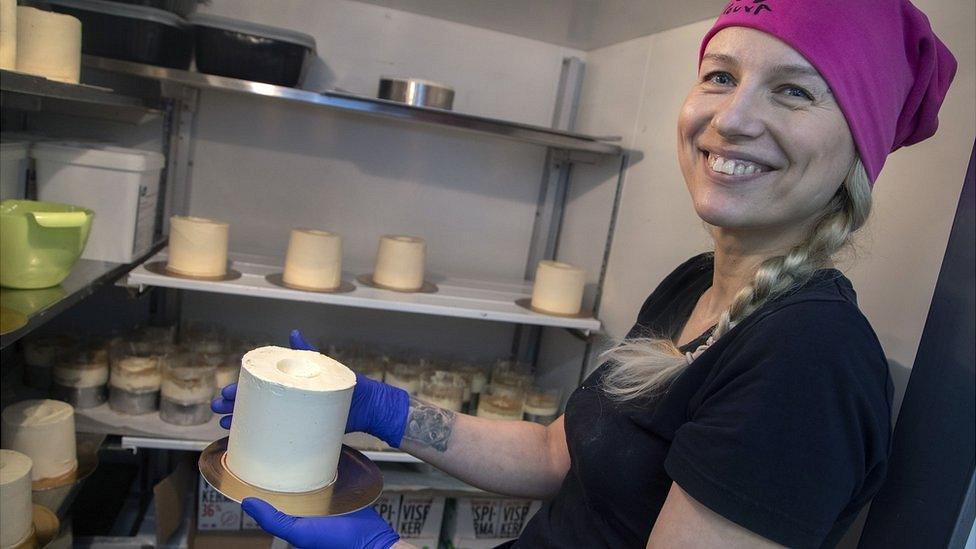 Uliana Timoreeva, baker at the Rottosrouva Bakery, creates a toilet paper cake, in Helsinki, Finland, 23 March 2020