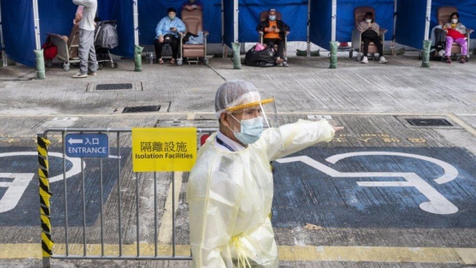 Medical worker directing patients with Covid symptoms in Hong Kong