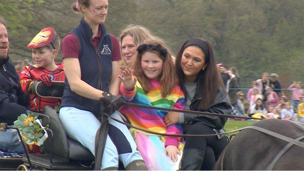 Elsie and family in carriage