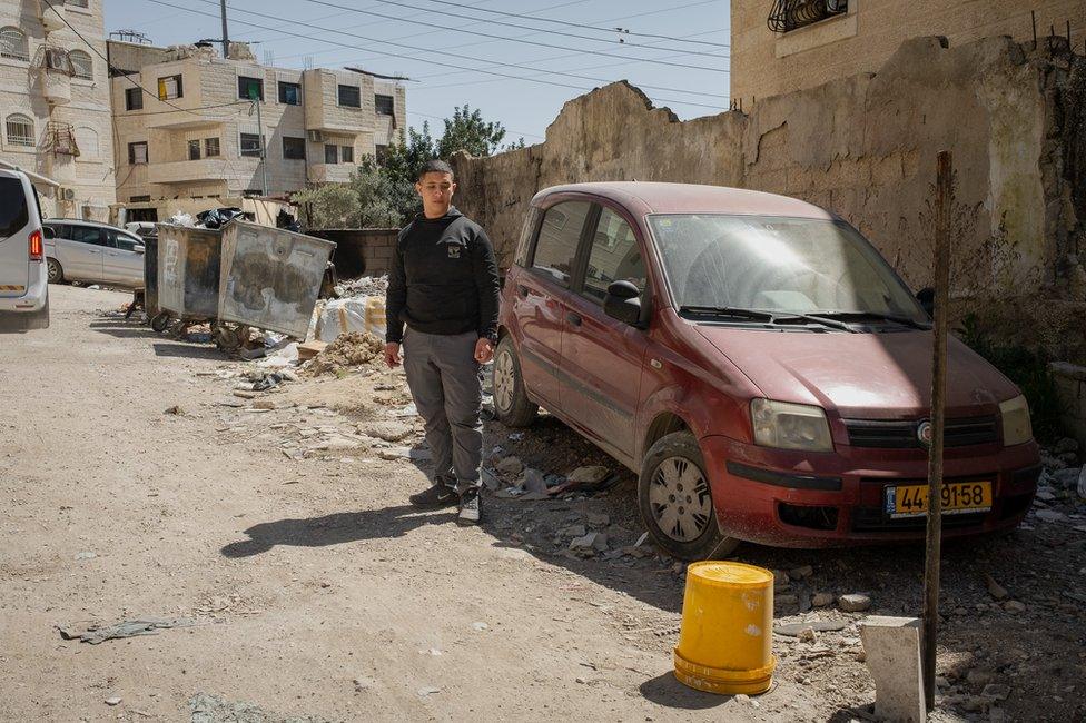 Rami's older brother Mahmoud, 19, looks at the spot where Rami was killed on Tuesday by a single bullet.