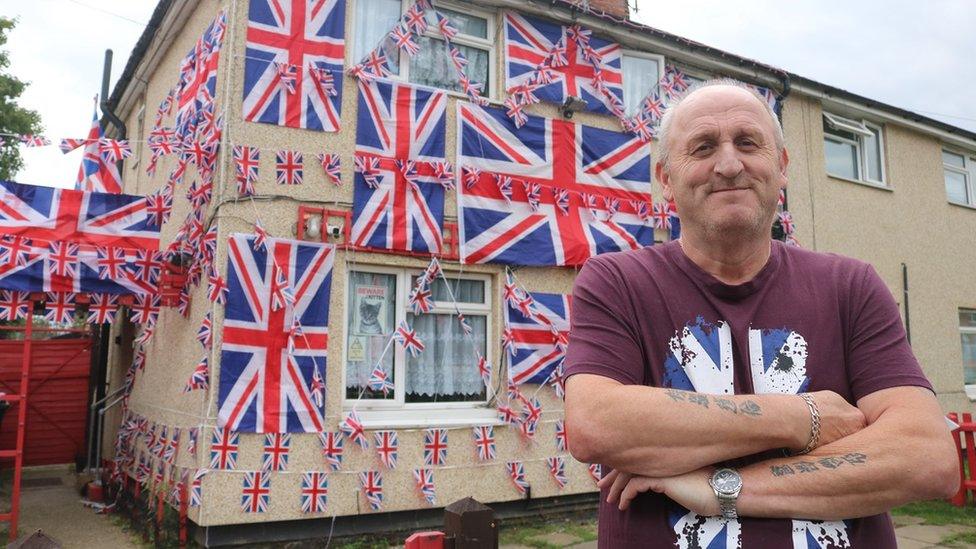 House covered in Union Jack flags