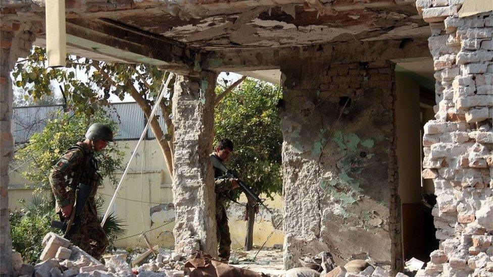 Afghan security forces inspect a building, used by insurgents to launch an attack on Pakistan"s consulate in Jalalabad, capital of Nangarhar province, Afghanistan, Wednesday, Jan. 13, 2016.