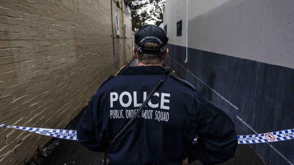 A police officer in a cordoned-off Sydney street