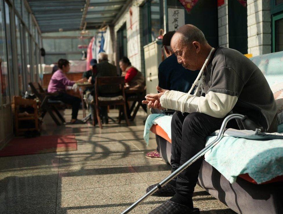 Residents in the conservatory at the care home run by Guohui Tang