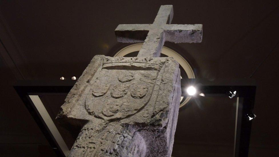 The Stone Cross on display in a Berlin museum