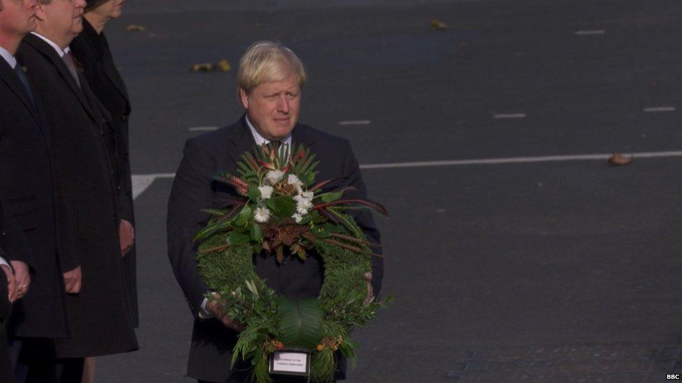 Foreign Secretary Boris Johnson with a wreath of tussock grass, slipper spurge and old father live forever, in a wreath for the overseas territories put together by Kew Gardens